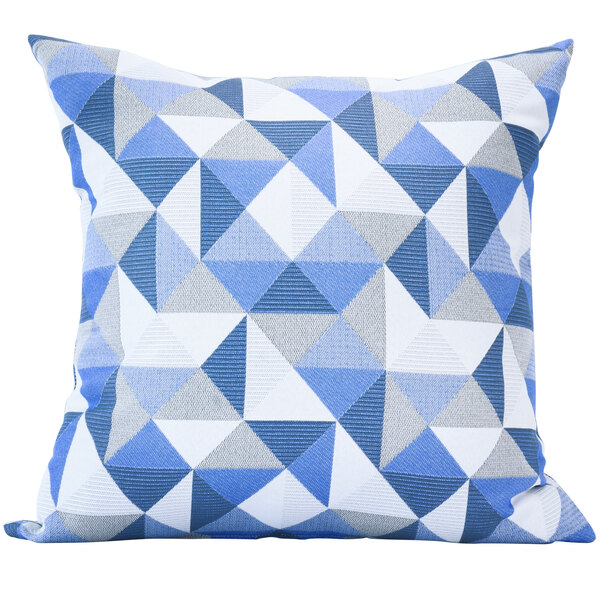 A white square pillow with a blue and white geometric pattern of triangles.