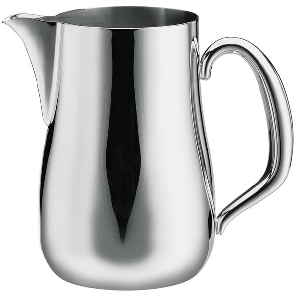 A Walco stainless steel pitcher with a handle.