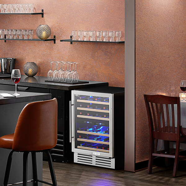 An AvaValley dual temperature wine cooler with glass doors filled with wine bottles.