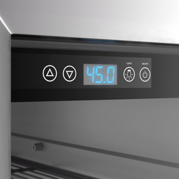 A commercial wine cooler with a digital temperature display and control panel.
