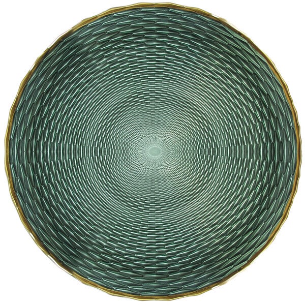 A close up of a green glass charger plate with a gold spiral design.