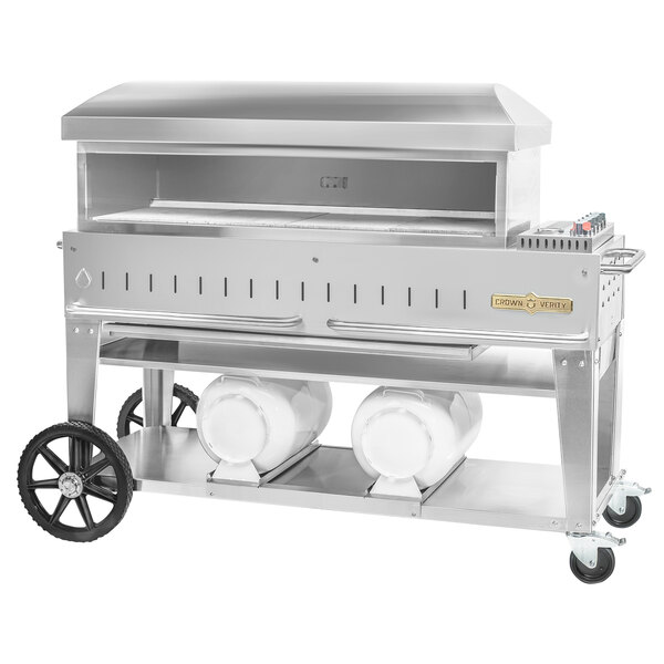 A large stainless steel Crown Verity Club Series outdoor pizza oven with wheels.