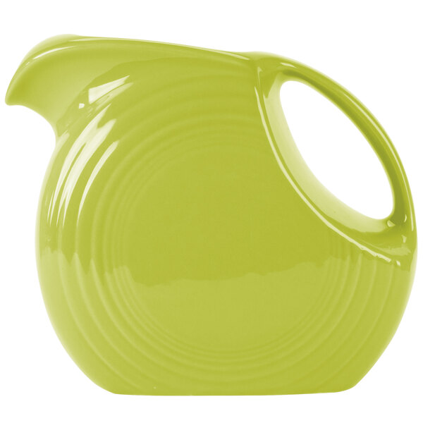 A Fiesta Lemongrass large disc pitcher with a handle.