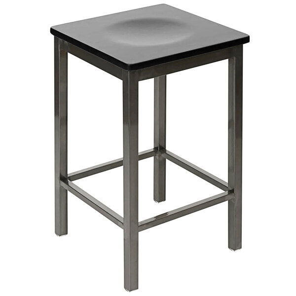 A BFM Seating black metal counter height bar stool with a black square wooden seat.