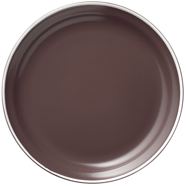 A brown Libbey Englewood porcelain plate with a white rim.