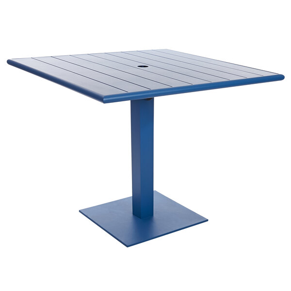 A blue square BFM Seating Beachcomber-Margate table with a metal base.