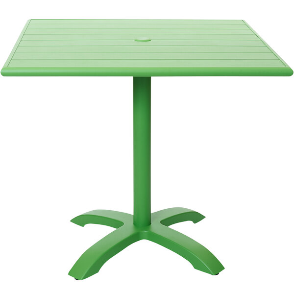 A lime green square table with a metal base.