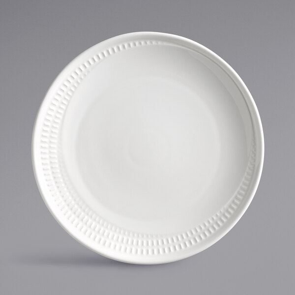 A white Libbey Royal Rideau coupe plate with a decorative edge.