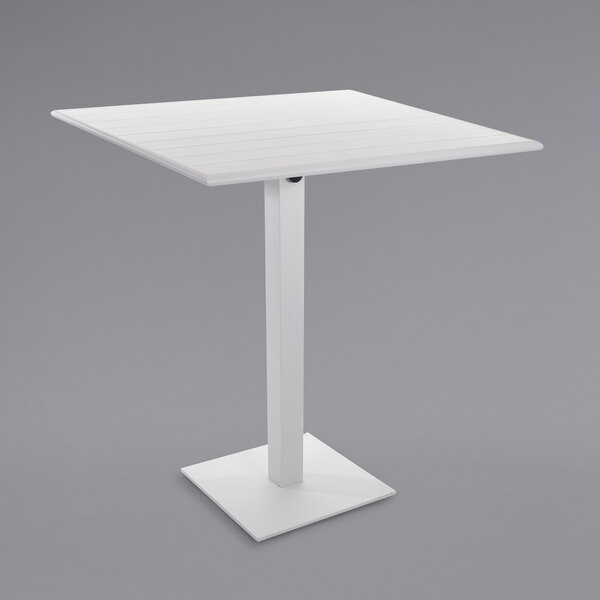 A white rectangular table with a white square base.