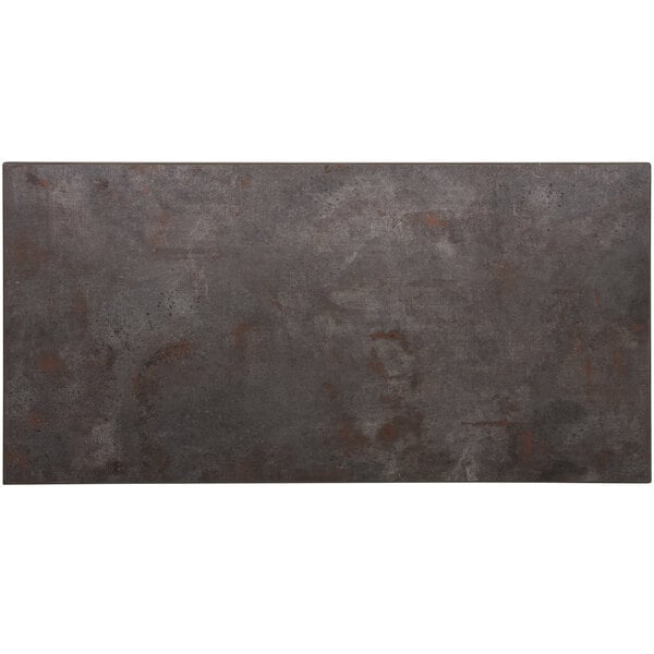 A rectangular metal table top with a rust colored surface and matching edge.