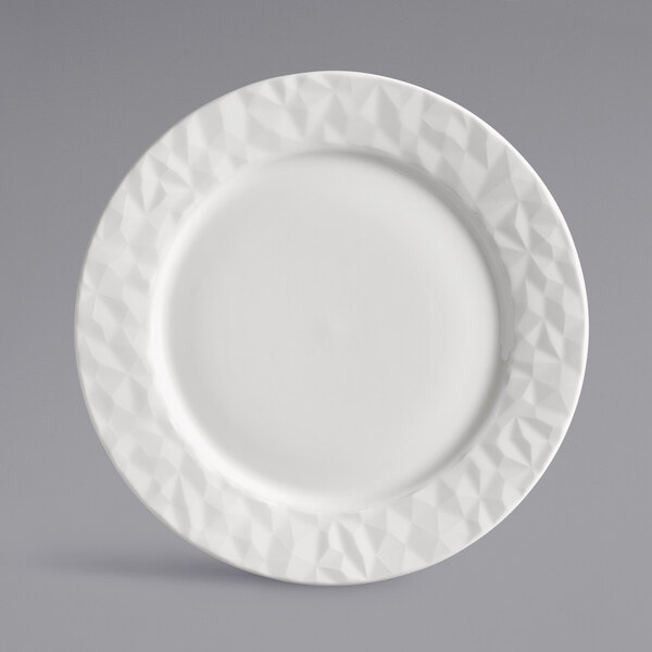 A white Reserve by Libbey porcelain plate with a wide rim and diamond pattern.