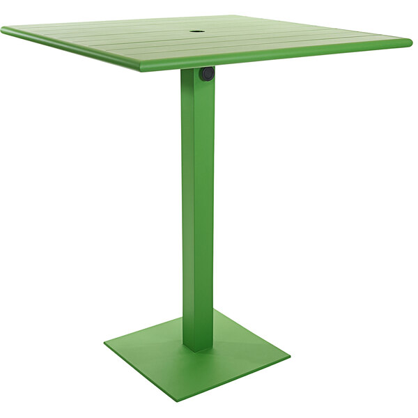 A BFM Seating Beachcomber-Margate lime green square table with a square base and umbrella hole.