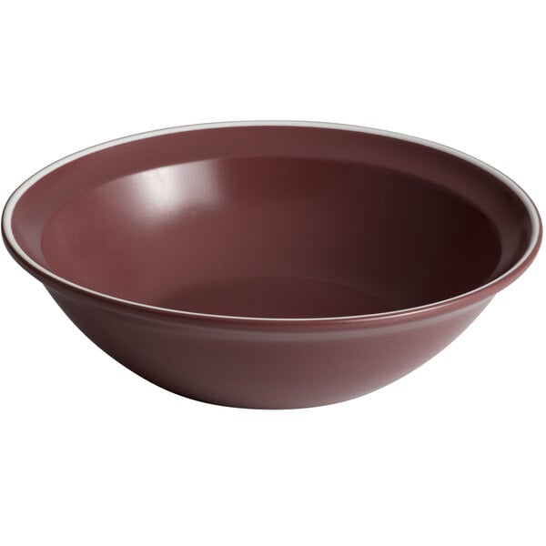 A close-up of a Libbey Englewood salad bowl with a white rim and matte mulberry interior.