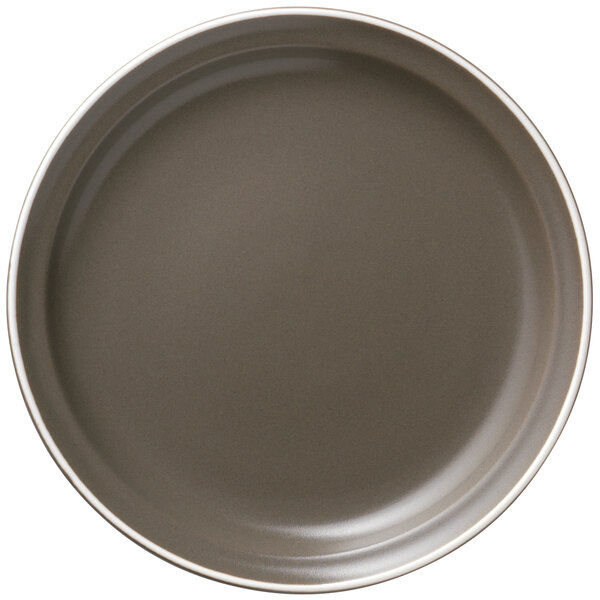 A matte olive Libbey porcelain plate with a white rim.