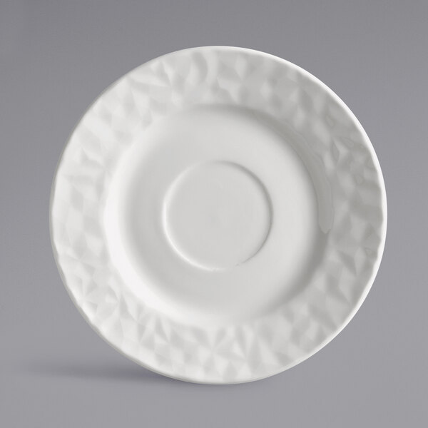 A white Reserve by Libbey Royal Rideau porcelain saucer with a circular design.