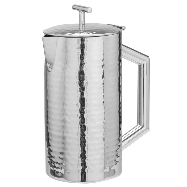 A silver stainless steel Walco beverage server with a hammered finish and a handle.
