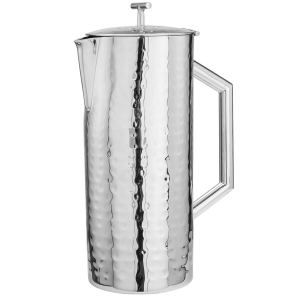 A silver stainless steel Walco beverage server with a hammered texture.