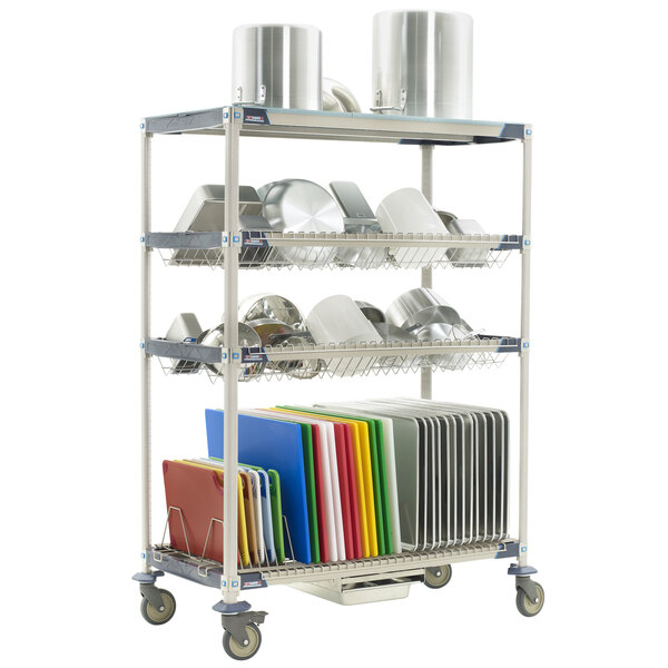 A MetroMax i mobile rack with white trays on it.