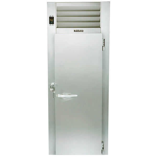 A Traulsen Correctional Roll-Thru heated holding cabinet with a stainless steel door and a vent.