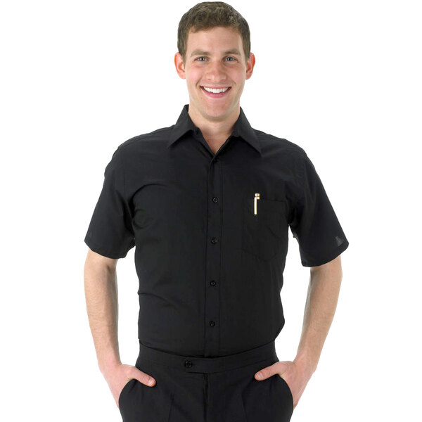A man wearing a black Henry Segal short sleeve dress shirt and black pants.