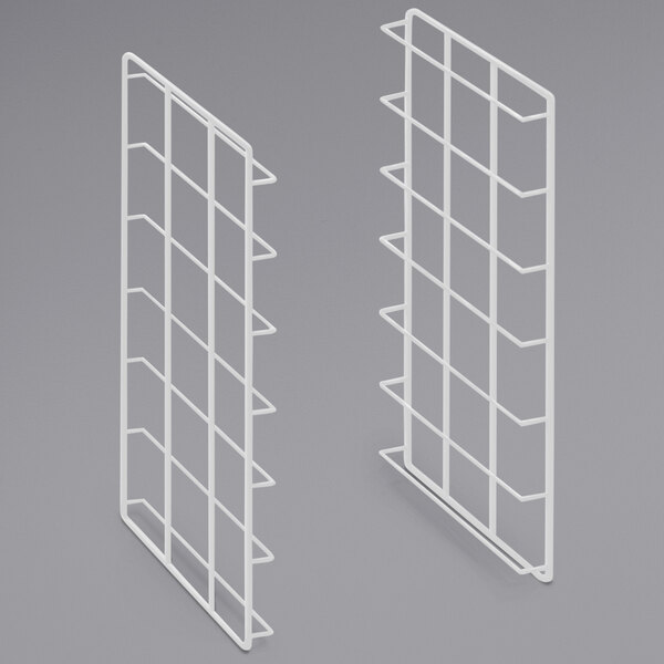 A pair of white wire shelves with a grid.