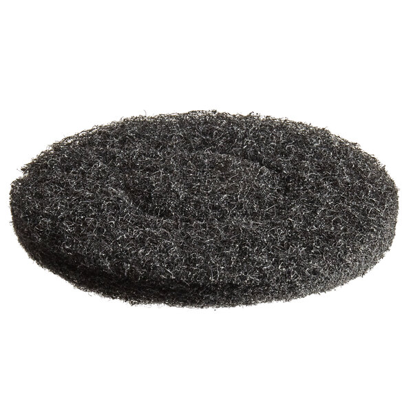 A close-up of a black MotorScrubber stripping pad.