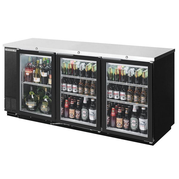 A black Beverage-Air underbar height refrigerator with glass doors filled with bottles of beer.