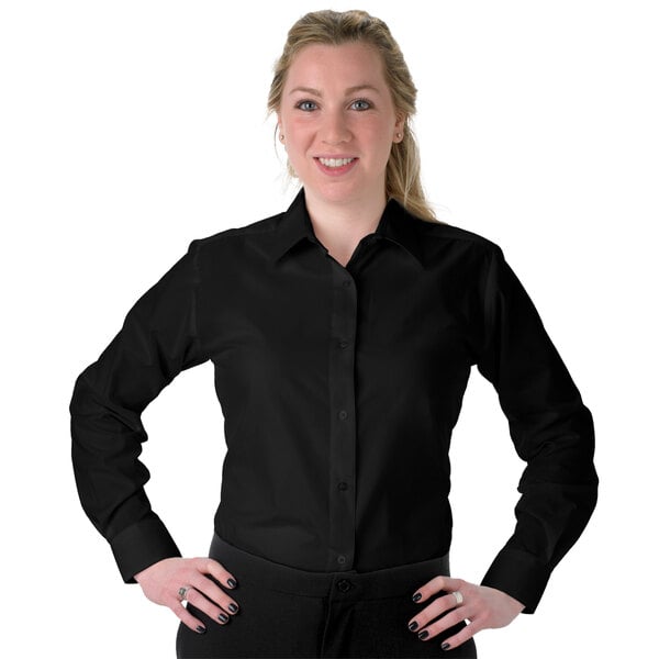 A woman wearing a black Henry Segal long sleeve dress shirt.