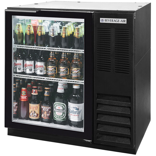A Beverage-Air black underbar wine refrigerator with bottles of beer inside.