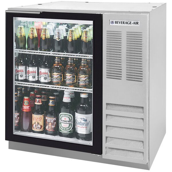A Beverage-Air underbar wine refrigerator with bottles of beer inside.