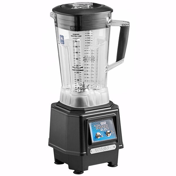 A Waring commercial blender with toggle switches and a clear container.