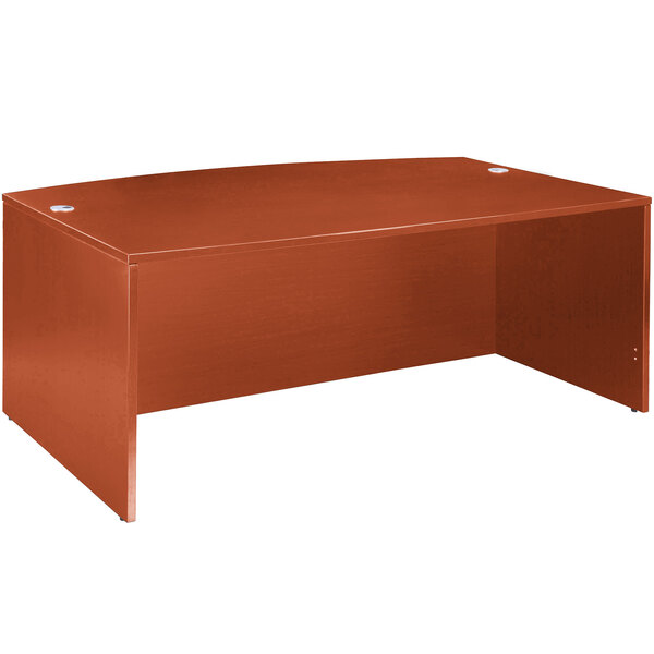 A brown Boss cherry laminate bow front desk shell.
