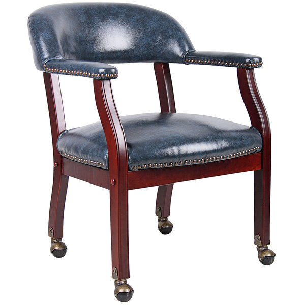 A blue vinyl Boss Captain's Chair with wooden wheels.