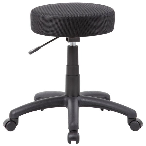 A close up of a black Boss Office mesh DOT stool with wheels.