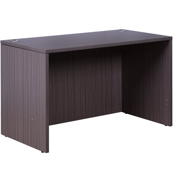 A Boss driftwood laminate desk shell with a dark wood finish on a table with a white background.