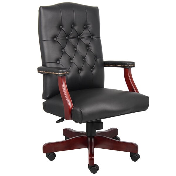 A Boss black leather office chair with mahogany legs.