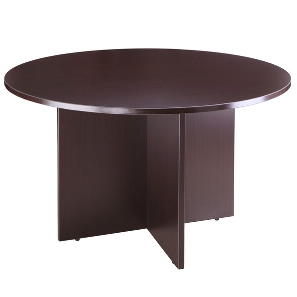 A Boss mocha laminate round office table with a dark wood finish.