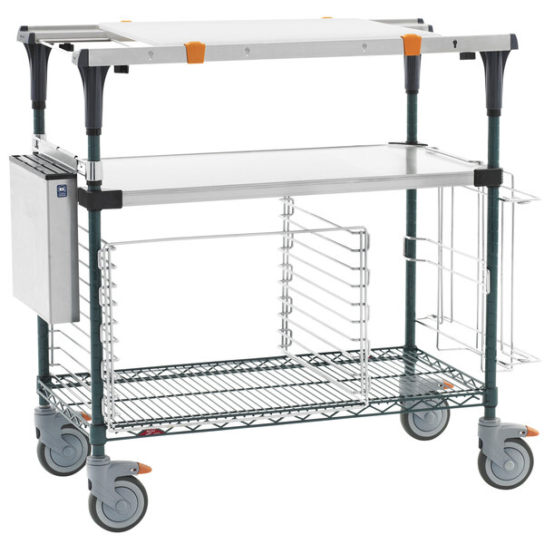 A Metro PrepMate MultiStation cart with shelves and a tray on it.