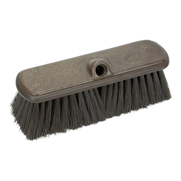 A brown Carlisle Sparta vehicle and wall cleaning brush with black bristles and a handle.