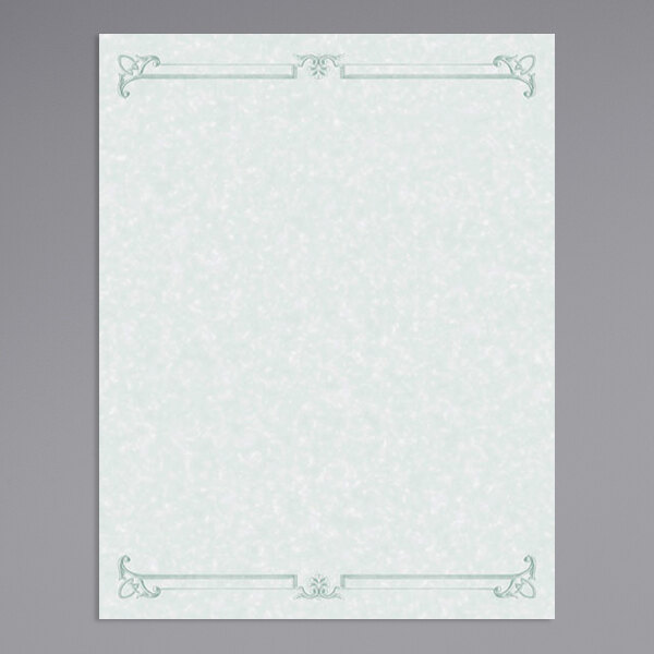 A white paper with a green decorative border with a swirl pattern.