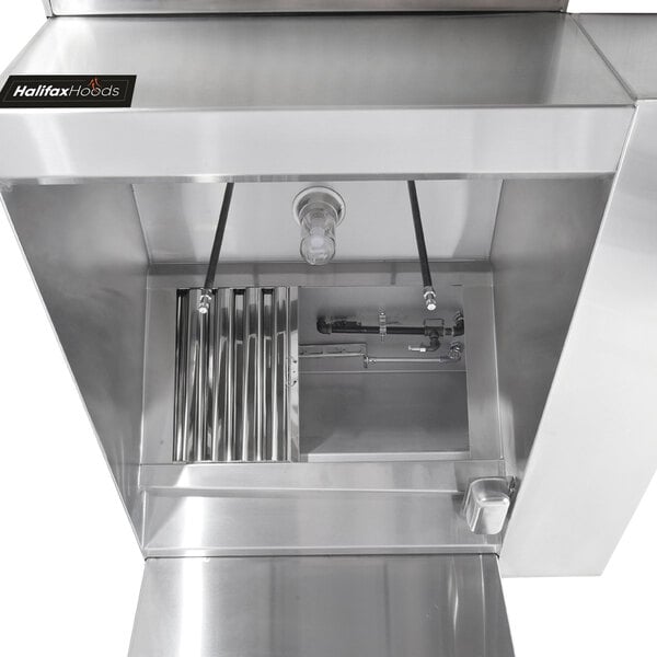 A Halifax BRP commercial kitchen hood system with metal pipes and valves.