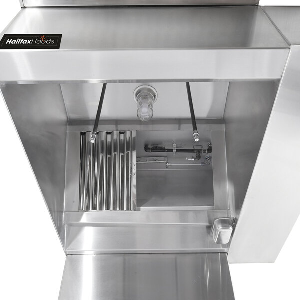 A stainless steel Halifax commercial kitchen hood box with pipes and valves inside.