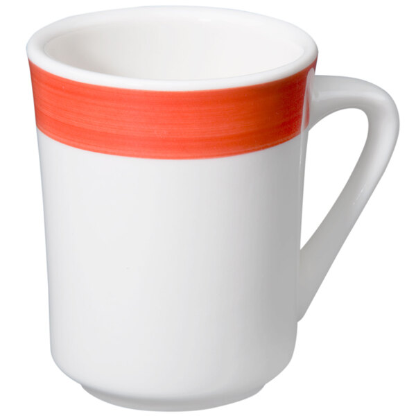 A white coffee mug with orange and red accents.