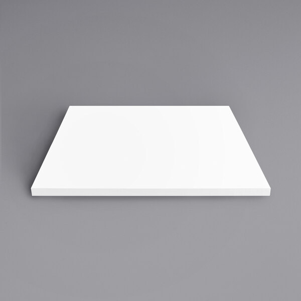 A white square Art Marble Furniture table top on a gray background.