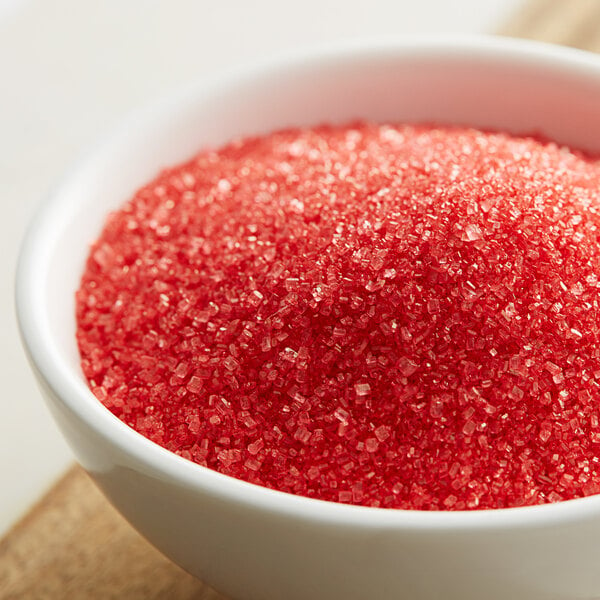 A bowl of red sanding sugar.