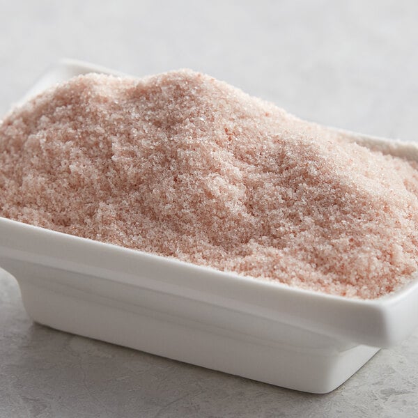 A white bowl of Regal Fine Grain Pink Himalayan Salt.