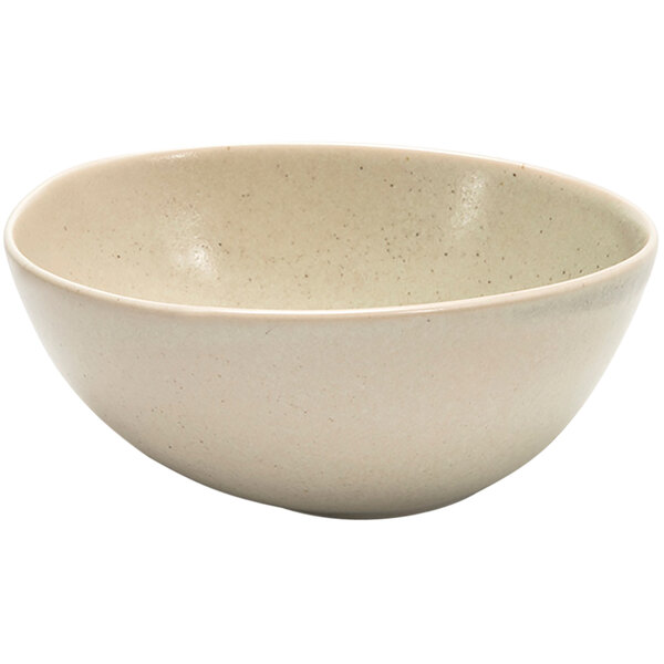 A white bowl with specks on the rim.