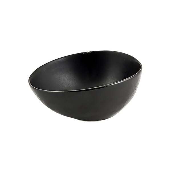 A close-up of a black Front of the House pepper ramekin.