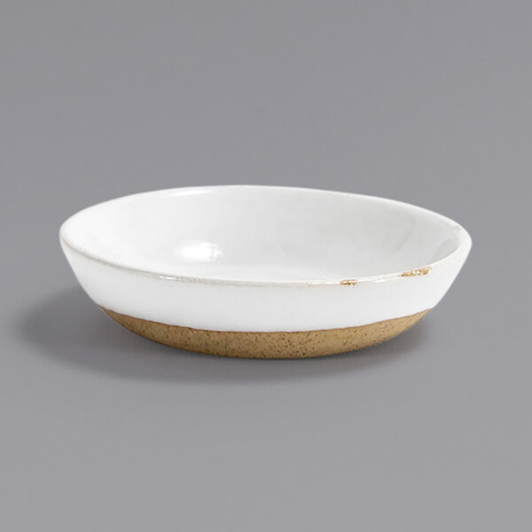 A white Front of the House Artefact ramekin with a brown rim.