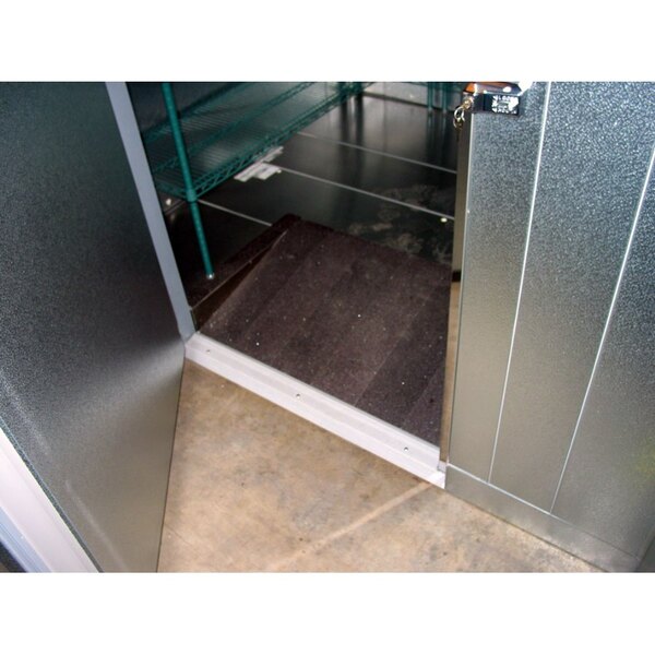 A Norlake Kold Locker walk-in door with a non-skid floor strip on the floor.